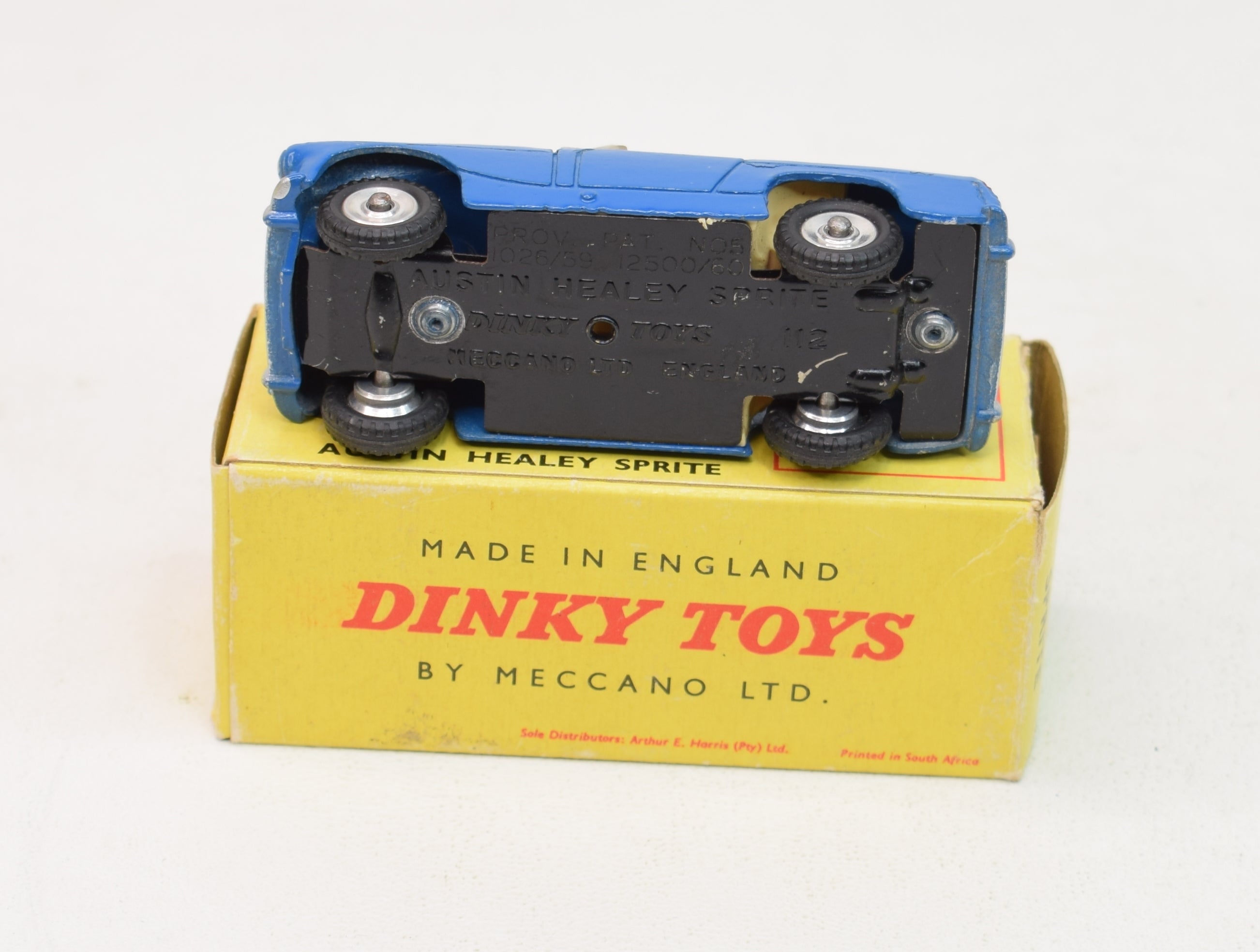 A Dinky Toys No. 103 Austin Healey '100' Sports, finished in cream, and A Dinky Toys No. 103 Austin Healey '100' Sports, finished in cream, and