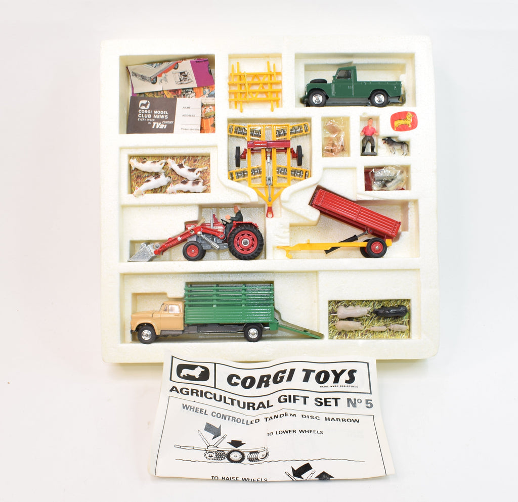 A Corgi Toys gift set No. 5 Agricultural Gift Set, comprising of Massey Ferguson tractor and trai