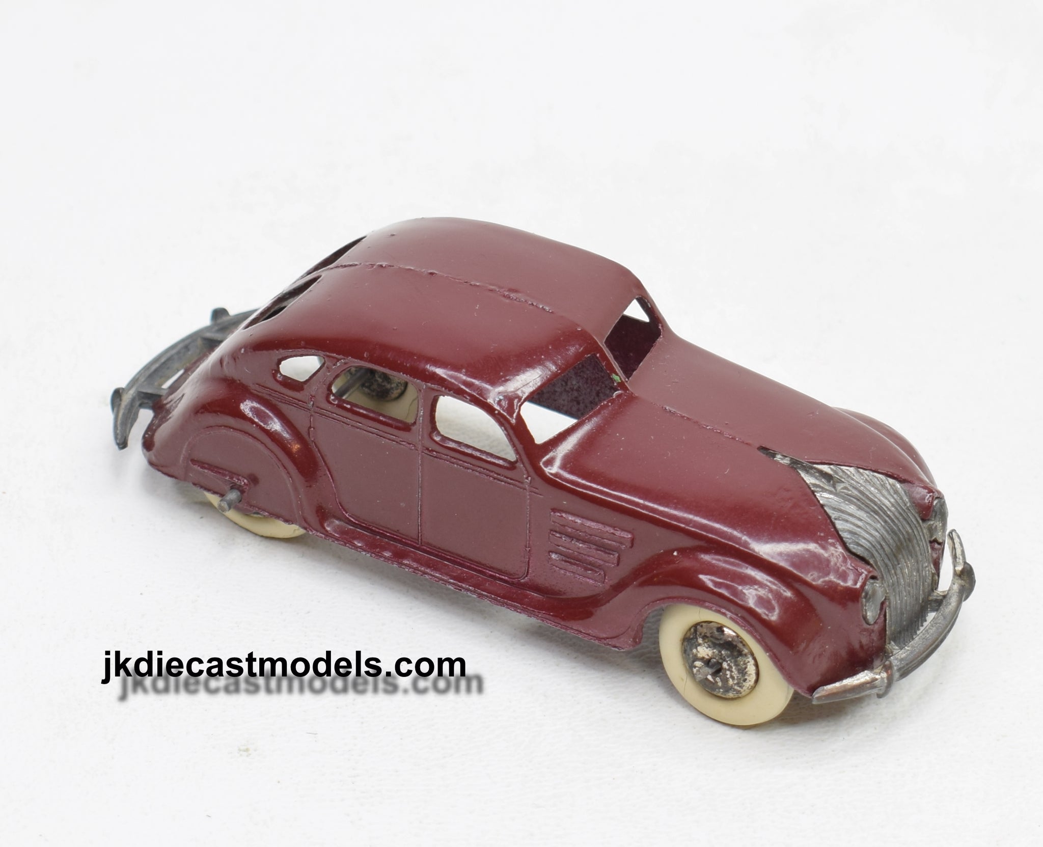 A Pre-war Dinky Toys No. 30a Chrysler Airflow With Turquoise Body And Blue Wheels A Pre-war Dinky Toys No. 30a Chrysler Airflow With Turquoise Body And Blue Wheels